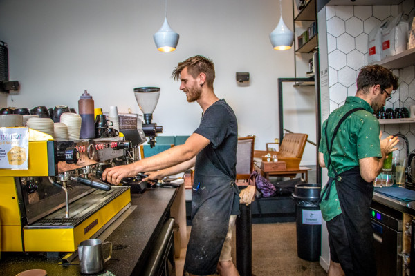 Baristas hold down the fort at busy Auckland local Crave Café.