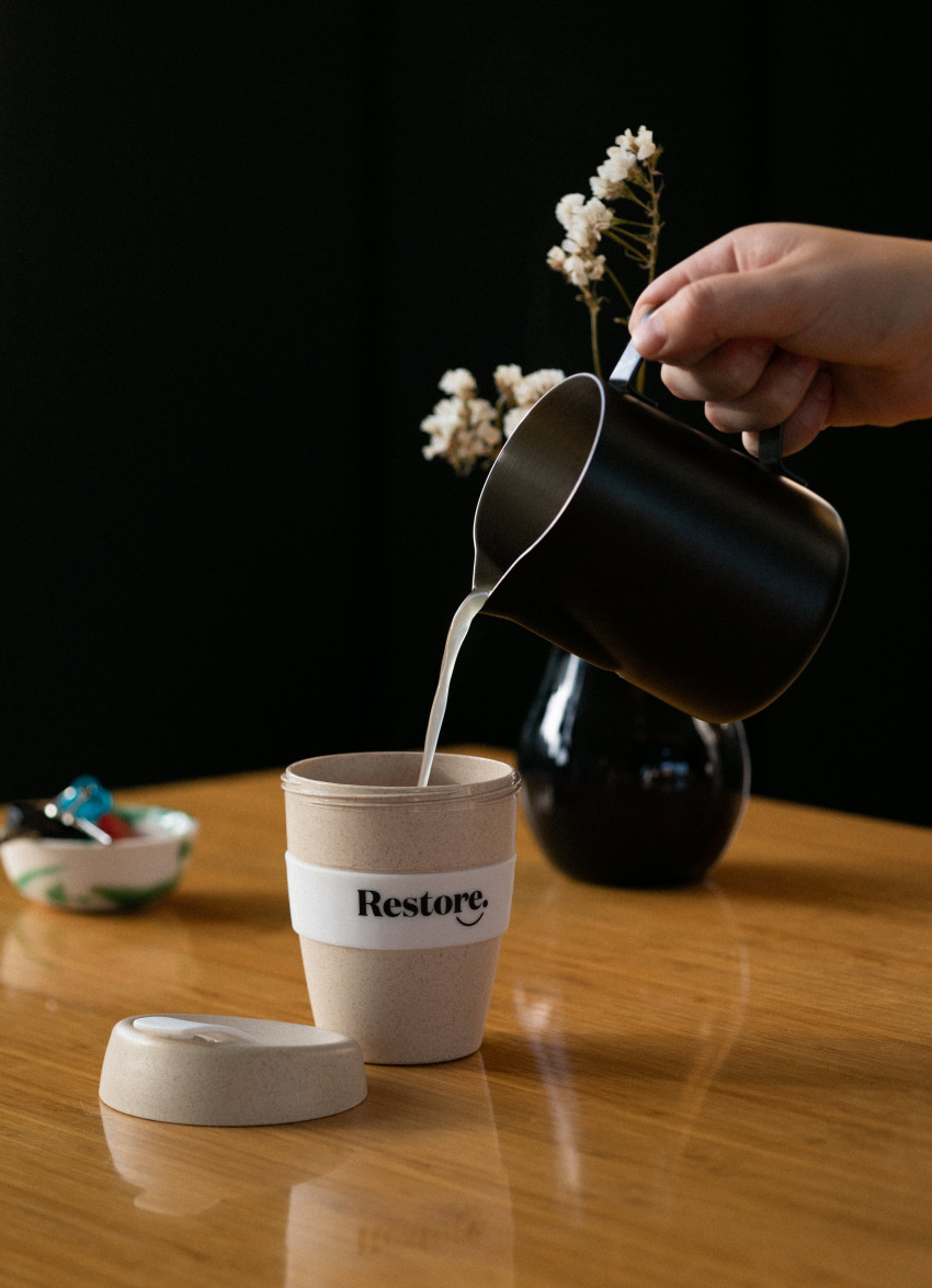 pouring Restore broth into cup