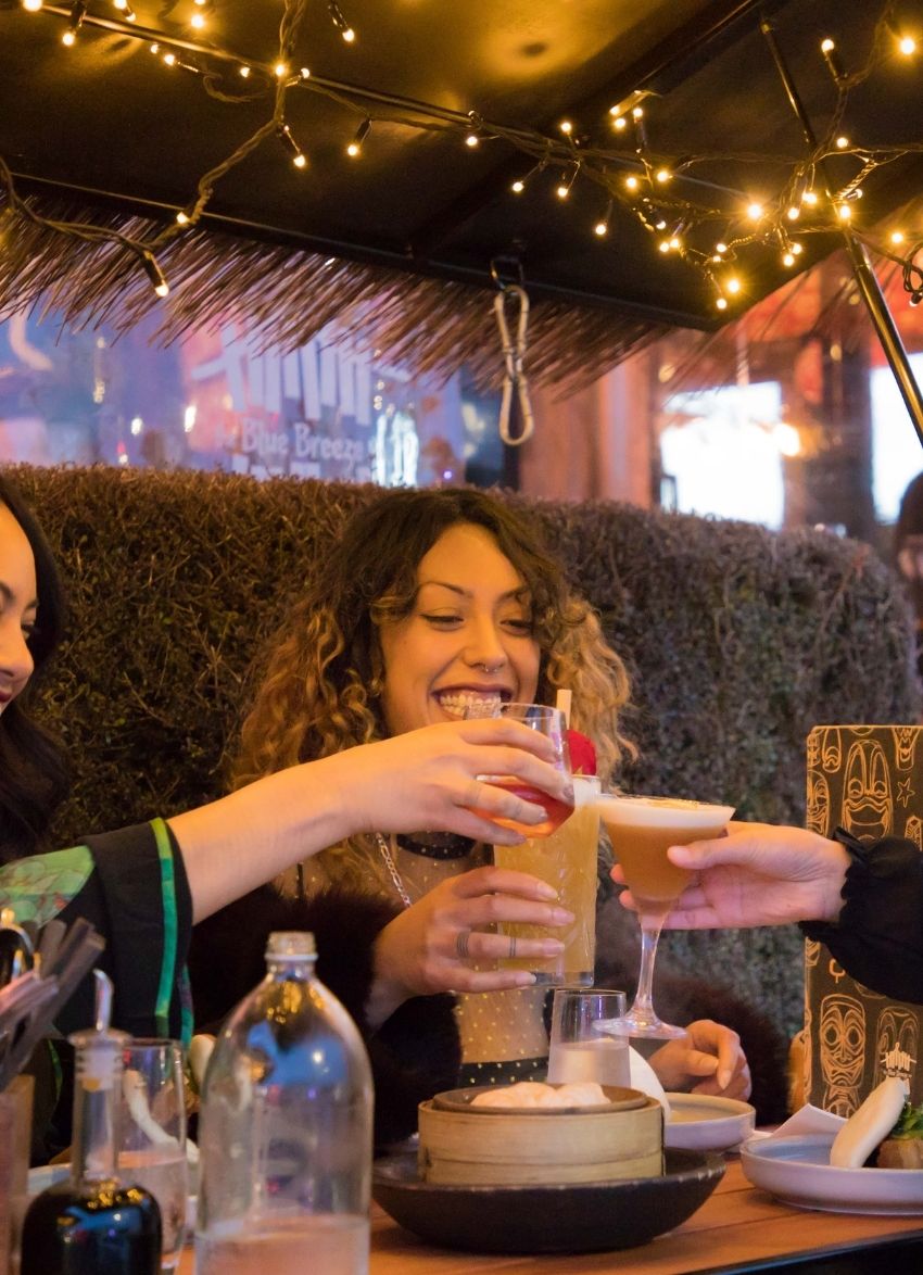 Group of friends enjoying drinks at Ponsonby Central