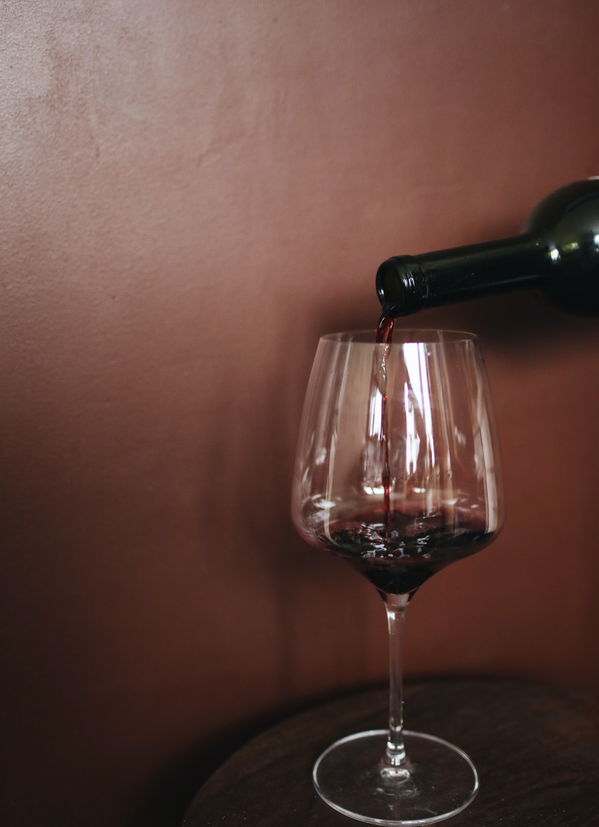 Red wine being poured into a glass