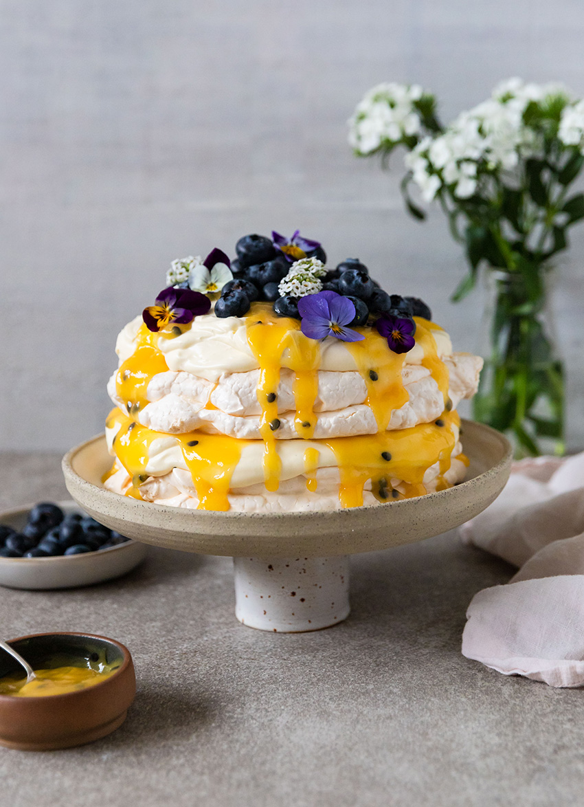 Layered Pavlova with Passionfruit Curd and Vanilla Cream