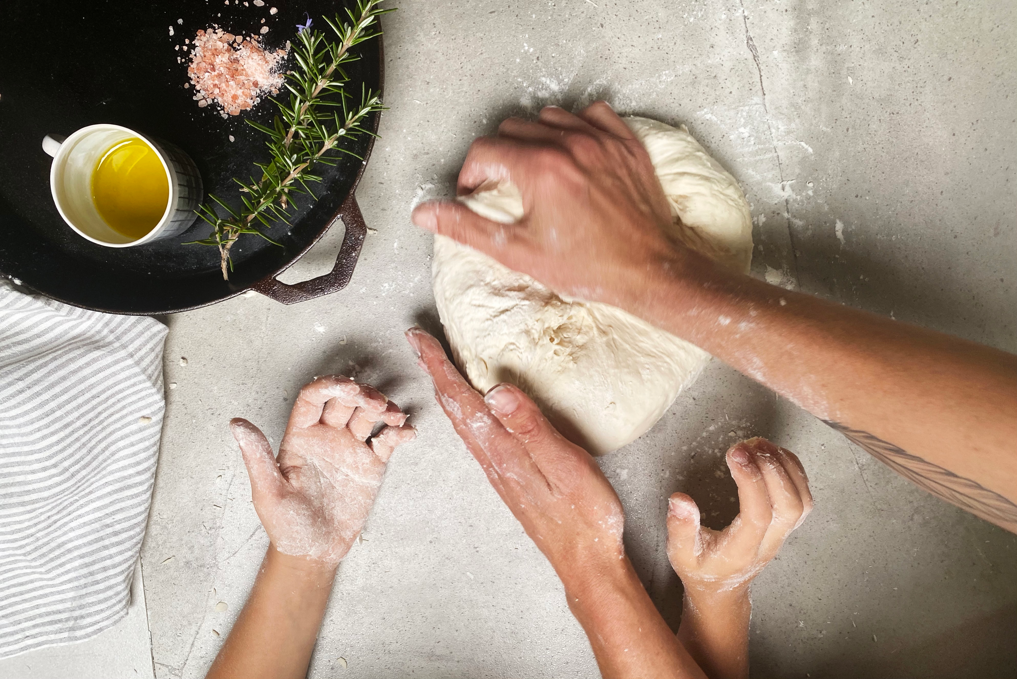 hands kneading dough