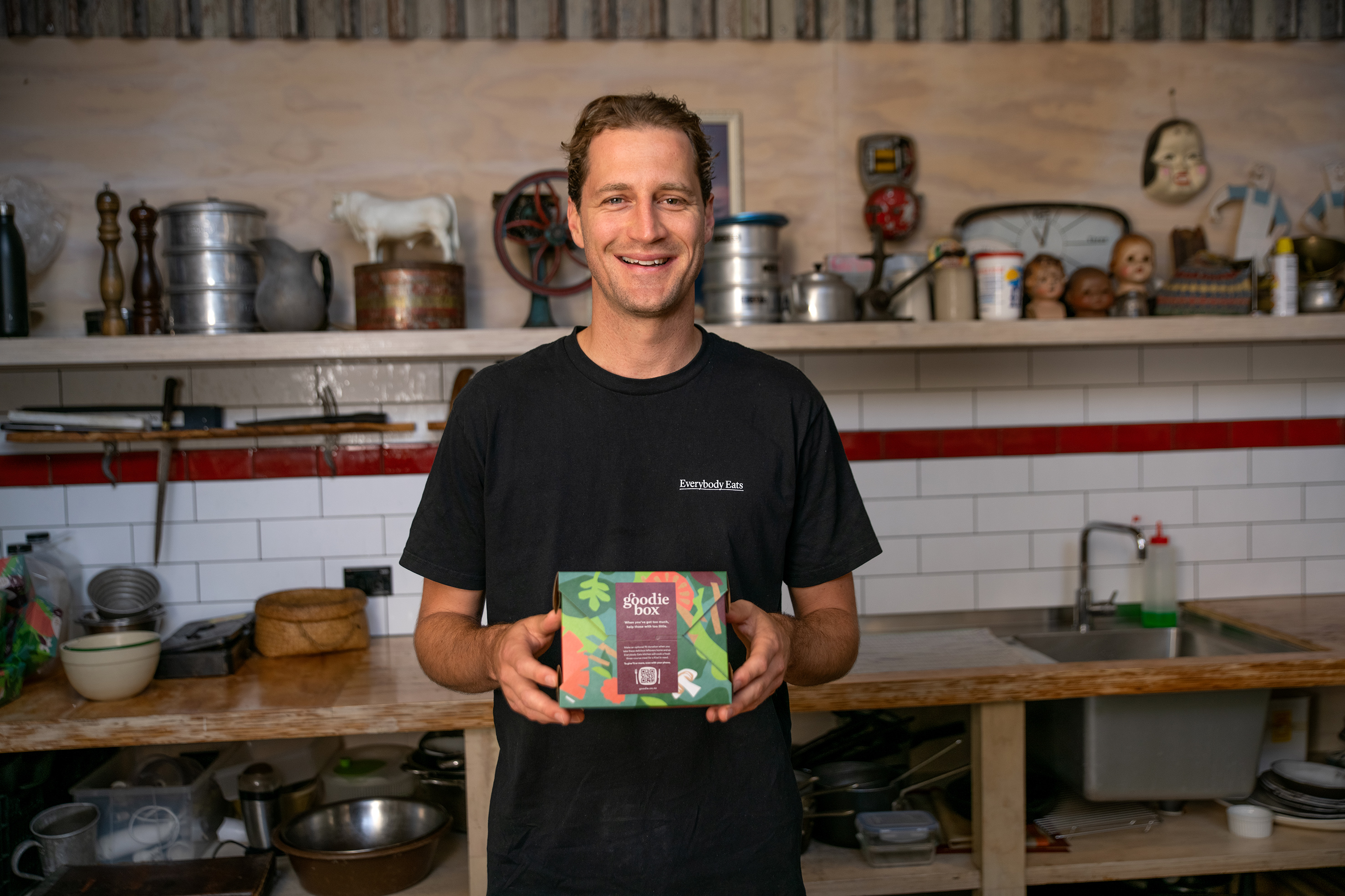 Nick Loosley, founder of Everybody Eats, holding a goodie box