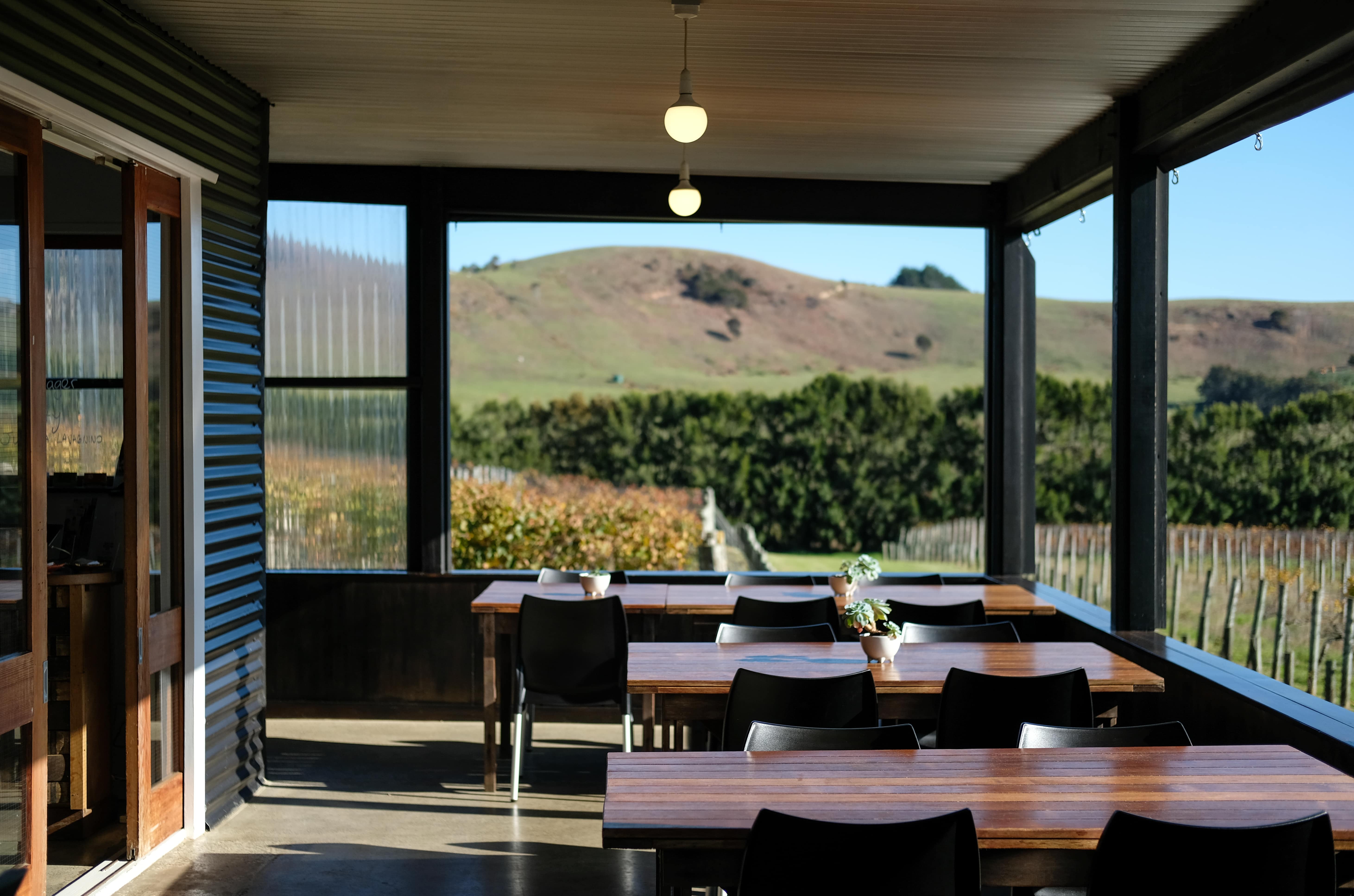 Empty tables at Te Motu vineyard