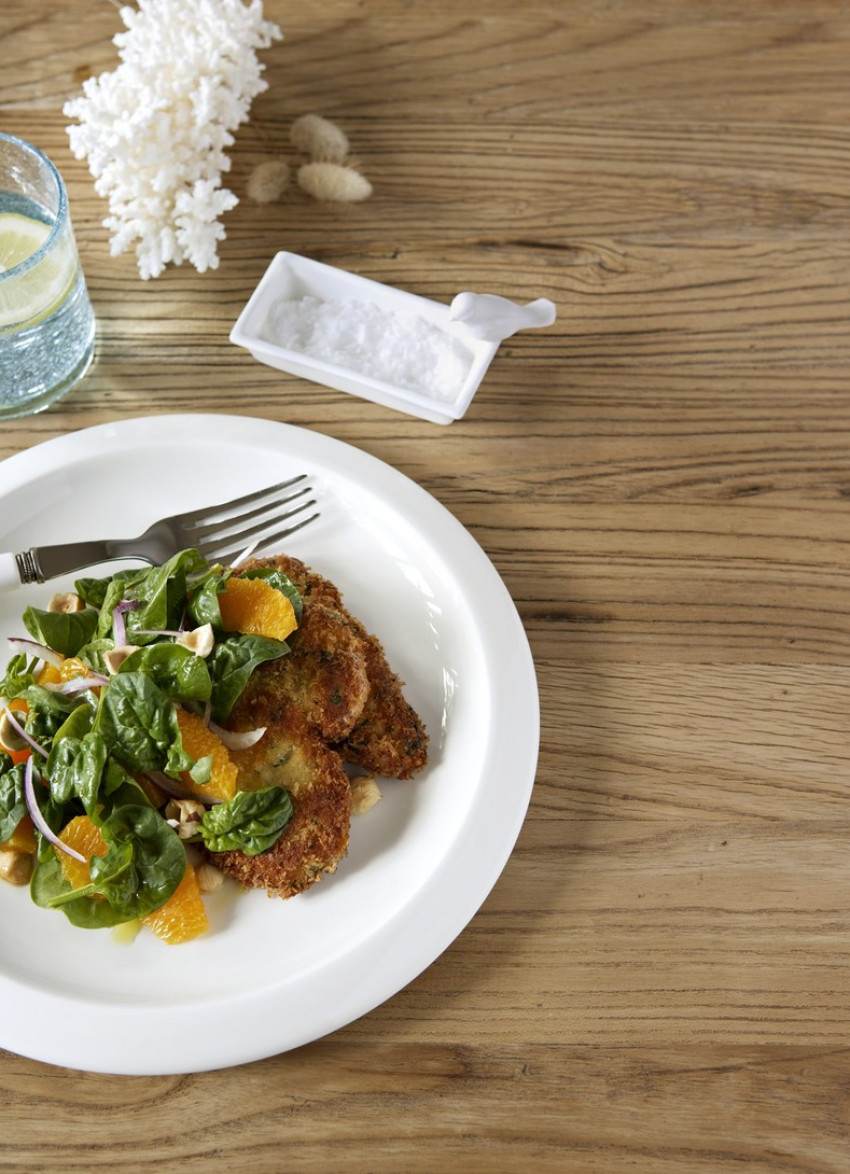 Crumbed Pork Schnitzel with Spinach, Orange and Hazelnut Salad