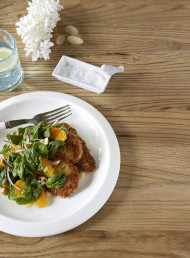 Crumbed Pork Schnitzel with Spinach, Orange and Hazelnut Salad