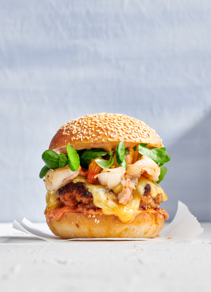 https://dish.co.nz/assets/media/images/chrozo-and-garlic-prawn-burger__FillWzg1MCwxMTc0XQ.png