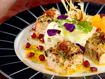 salmon dish with pomegranate seeds