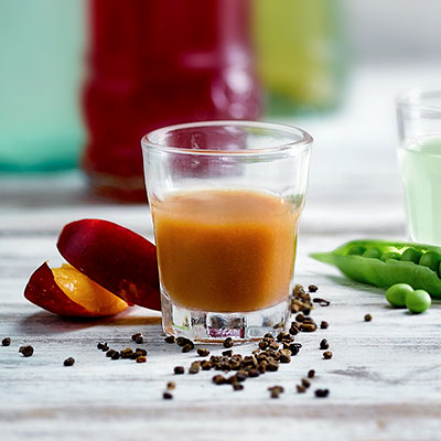 Image of a shot glass of nectarine puree