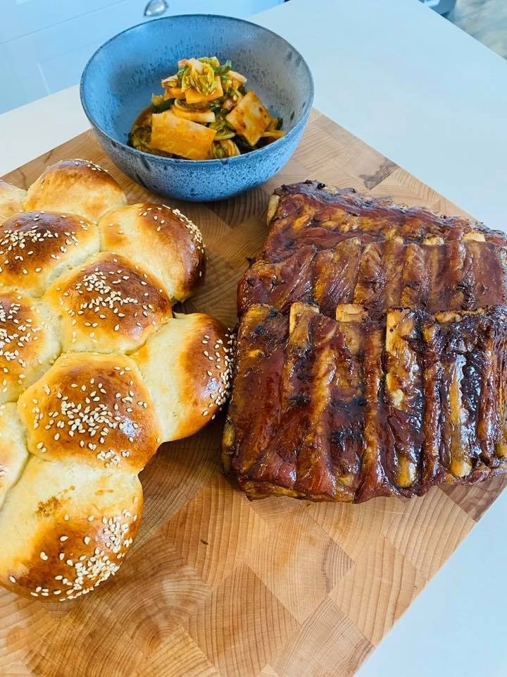 Sticky Master Pork Stock Ribs and Kimchi as made by Sid, Roan and Zoya this week with homemade brioche buns.